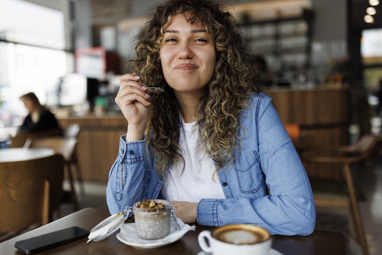 woman eating cafe coffee