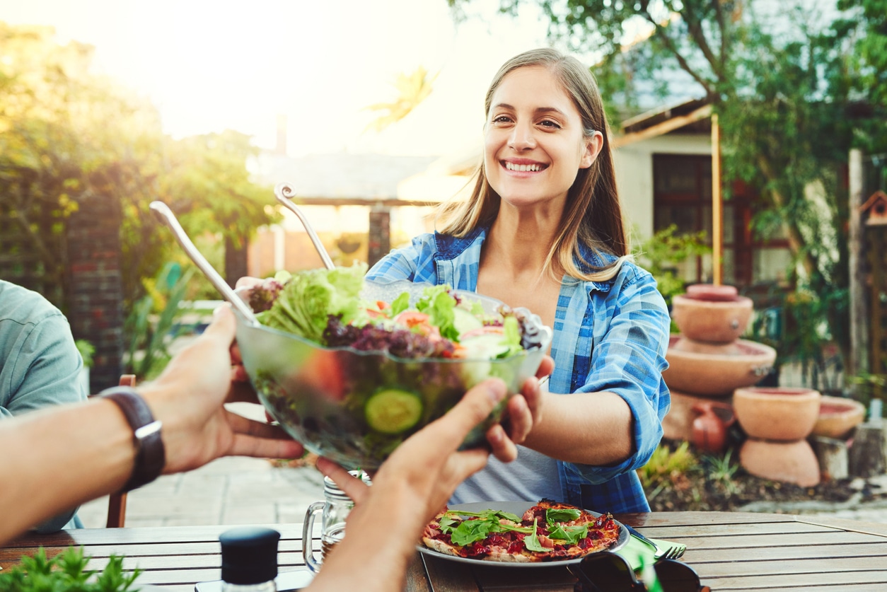Woman Passing Salad